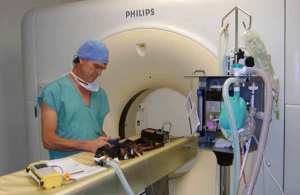 Company founder Colin Dunlop anesthetizing a dog for a CT scan